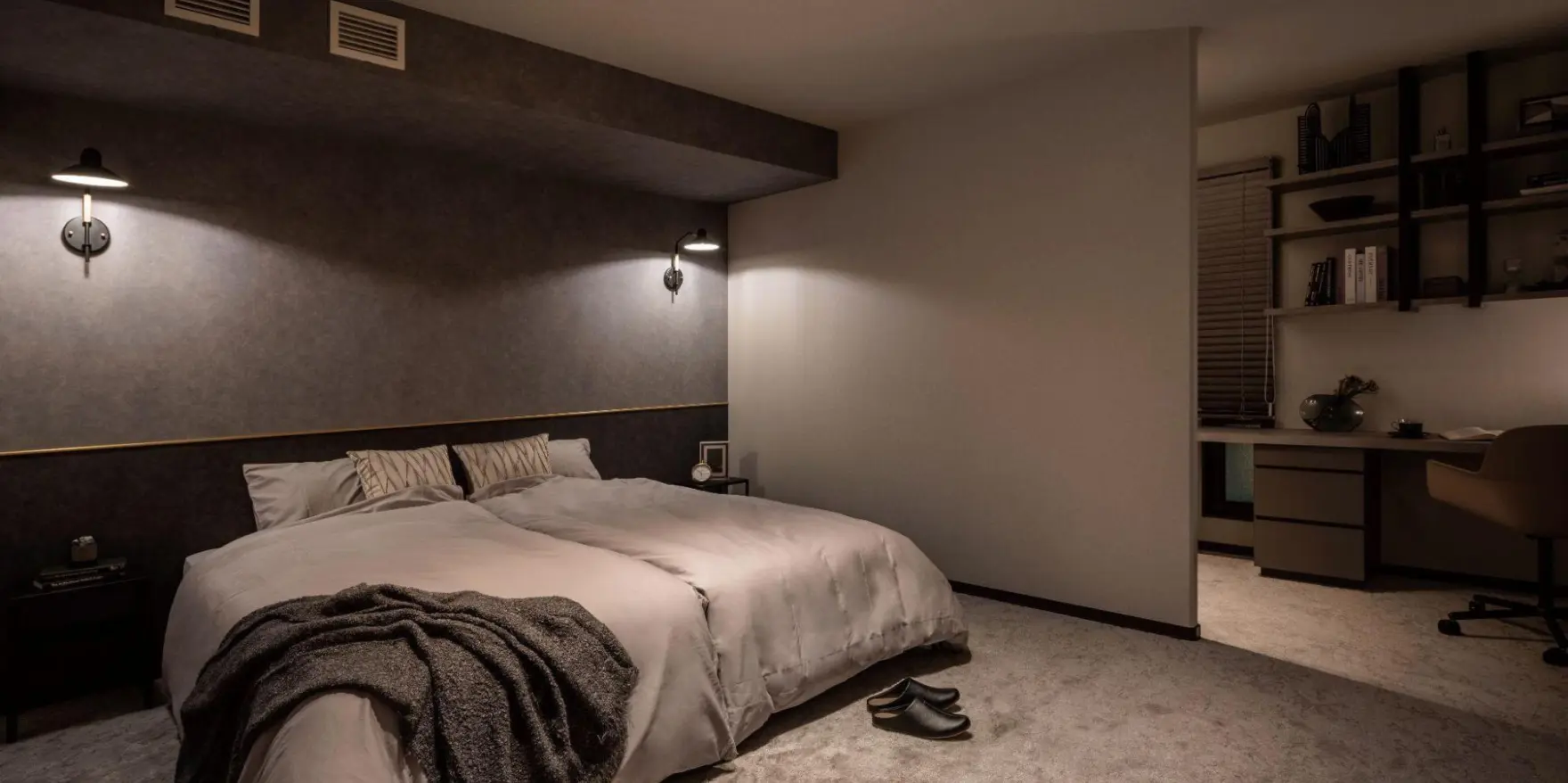 部屋の一角に書斎を設けた寝室