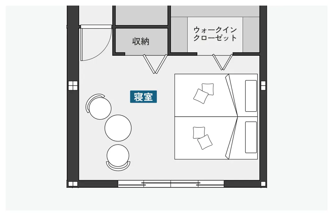 テーブルとチェアを置いた主寝室の間取り図